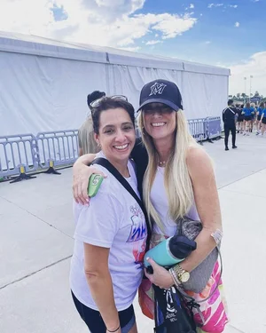 Tracey with another participant at an outdoor race event.